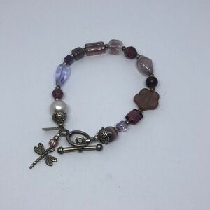 ARTISAN signed sterling silver dragonfly charm beaded bracelet.